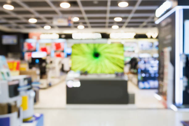 eletronic kaufhaus mit verschwommen bokeh-hintergrund - electrical equipment electronics store store shopping stock-fotos und bilder