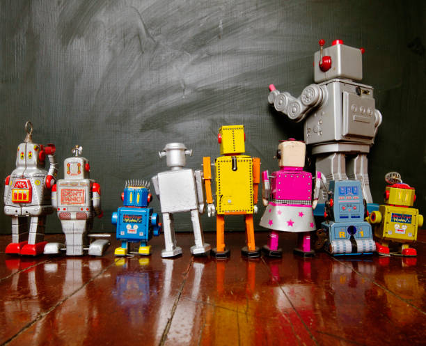 istock Big silver  robot toy teaches his class , 915921222