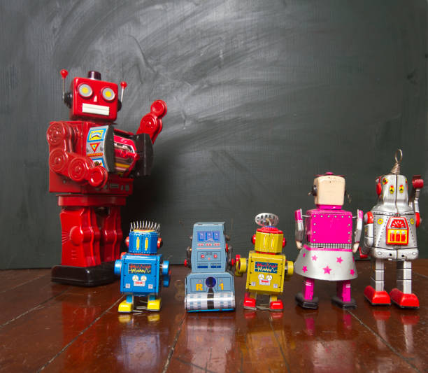 istock Big red robot toy teaches his class , 915921232