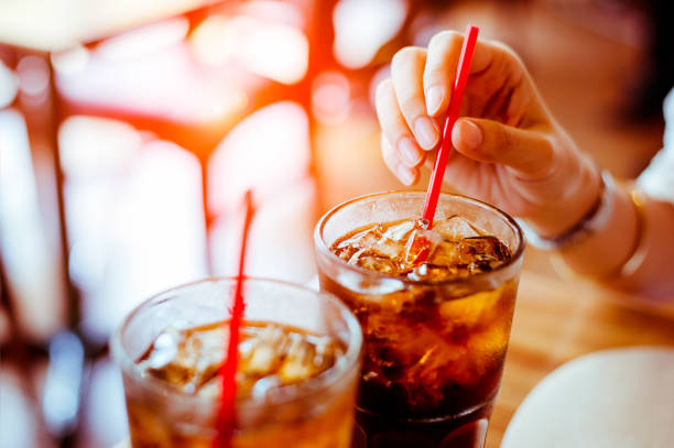 Two glass soft drink with ice in restaurant background stock photo