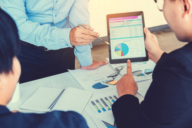 istock Business team meeting working on digital tablet new business project 915930448