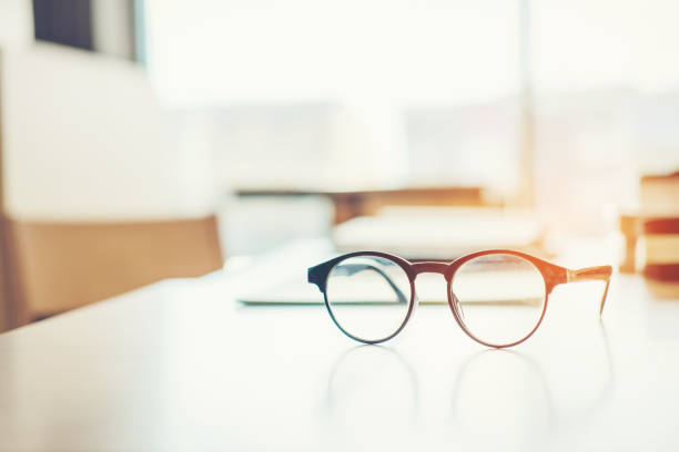 Eye Glasses on the study table education concept Eye Glasses on the study table education concept reading glasses stock pictures, royalty-free photos & images