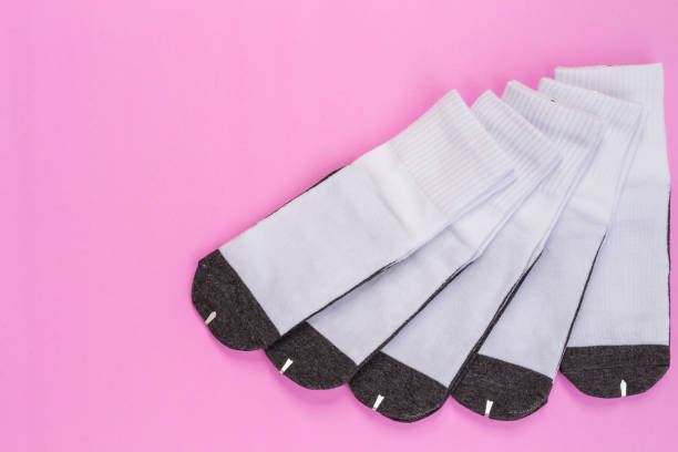 istock New white student sock on pink background with free space for design 915933578