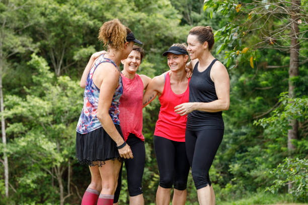 istock Mature Age Female Friends Celebrating After Completing Fun Run 915937118