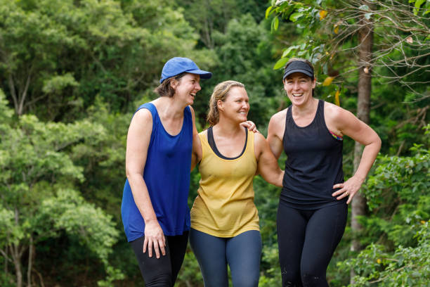 istock Mature Age Female Friends Celebrating After Completing Fun Run 915937198