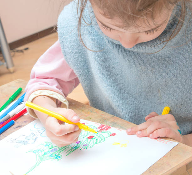 istock Little Girl with Markers 915943456