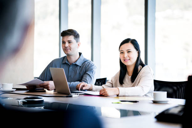 istock Business colleagues at conference table in office 915946496