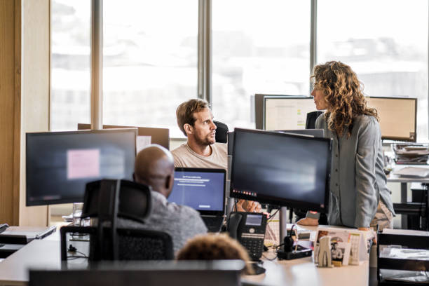 istock Business executives discussing at desk in office 915946752