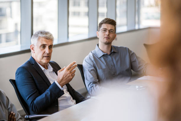 istock Business colleagues discussing in board room 915947342