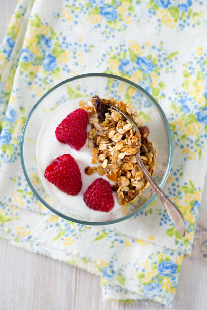 istock healthy snack - granola on wooden surface 915952410