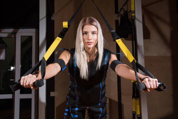 Beautiful young woman in Electrical Muscular Stimulation