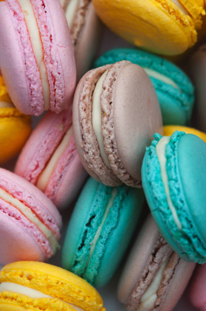 istock Colorful pastel macaroons background, top view. 915962068