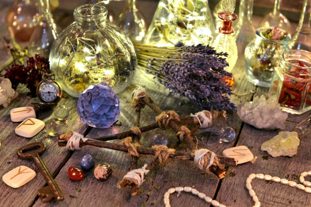 istock Magic ritual collection with bottles, lavender flowers, pentagram, runes and crystals 915967192