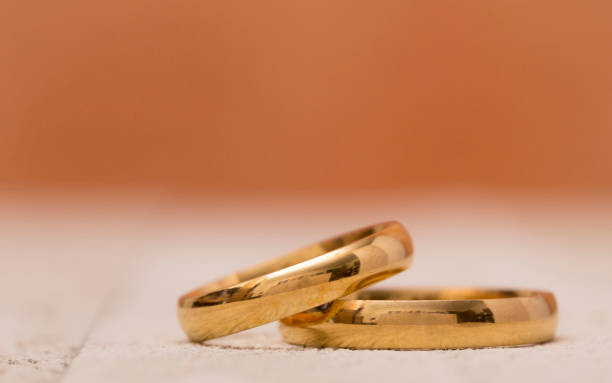 istock Macro View of Gold Wedding Bands 915971980