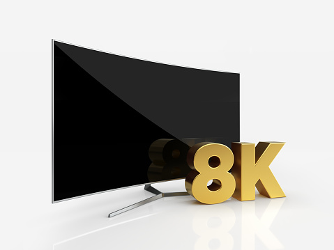 UHD Curved Smart TV with 8K icon on white reflective background. Horizontal composition with copy space. Clipping path is included.