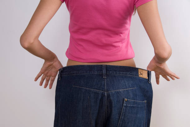 istock Woman wearing large jeans, diet 91597663