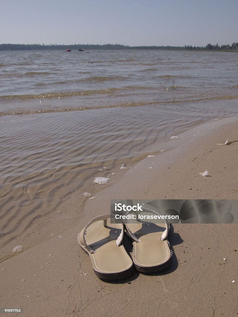 sandals on beach  Barefoot Stock Photo