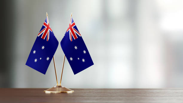 istock Australian Flag Pair On A Desk Over Defocused Background 915978214