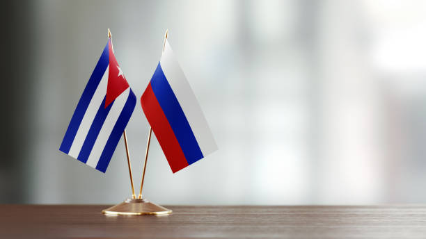 istock Cuban And Russian Flag Pair On A Desk Over Defocused Background 915978704