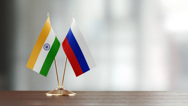 istock Indian And Russian Flag Pair On A Desk Over Defocused Background 915981196