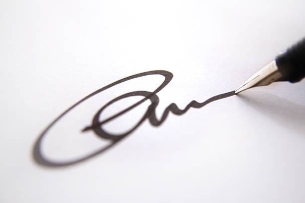 Close-up of pen and signature, strong blur effect  shorthand photos stock pictures, royalty-free photos & images