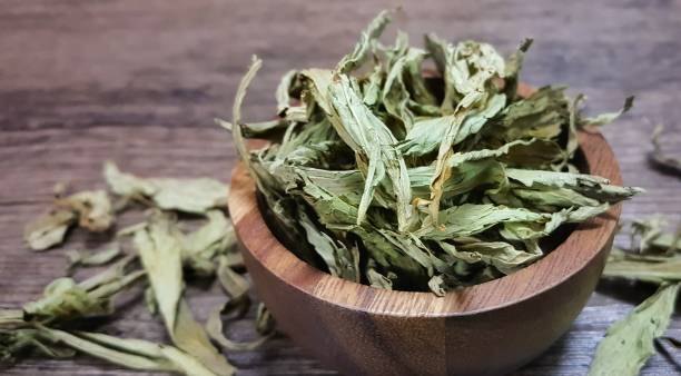 istock Dry Stevia on the wood bowl 915984010