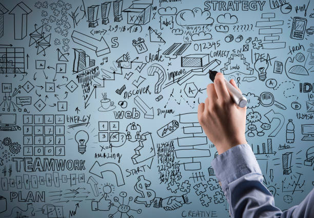 istock Female hand holding black felt tip pen with charts on background (Click for more) 915988836