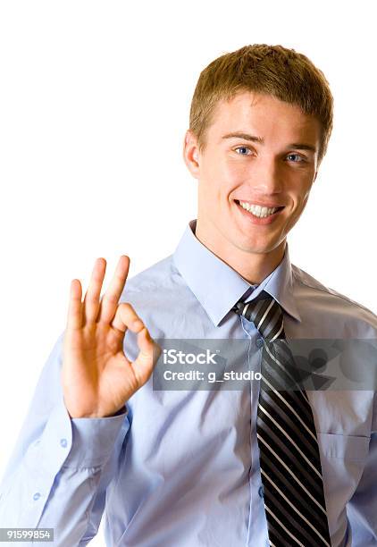 Foto de Retrato De Jovem Feliz Empresário Ou Estudante Balançando Um Bastão Isolado e mais fotos de stock de Acordo