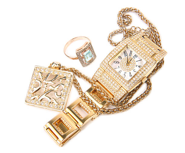 Jewelry set gold ring watch and earrings stock photo