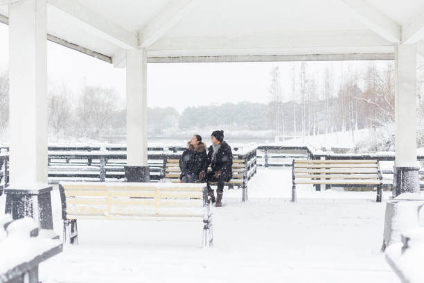 young couple sitting in a pavilion,China.