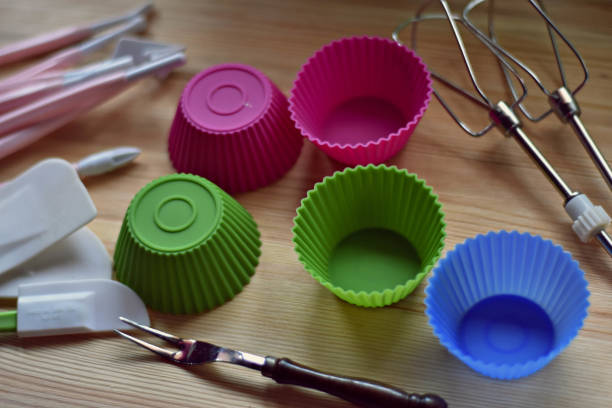 istock Colorful Mold for baking cupcakes on wooden background 916001486