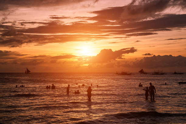 istock Beautiful sunset on Boracay white beach, Philippines 916005312