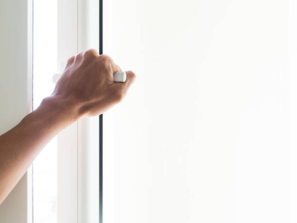 istock A man are opening the window with one hand. 916005592