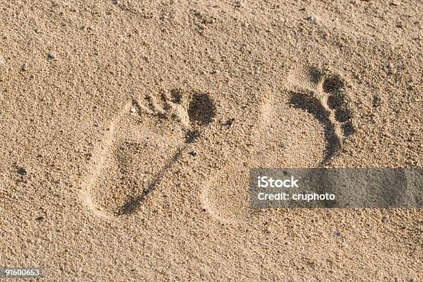 Two Foot Steps In The Sand Stock Photo - Download Image Now - Aiming, Animal Foot, Aspirations