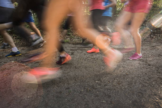 istock Group of unrecognizable marathon runners having a race in blurred motion. 916007914