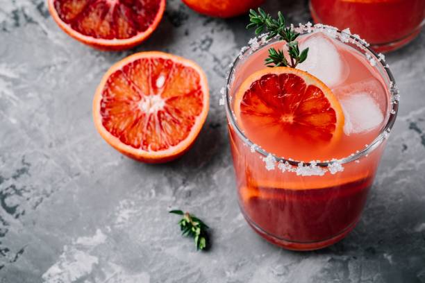 istock Blood Orange Margarita coctail with ice and thyme 916016002
