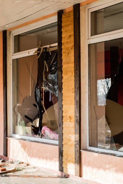 istock A broken window in an old abandoned building. Broken glass on the window site. Old building. 916018480