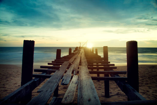 Sunset beach pier with relaxing moment time in nearly dark stock photo