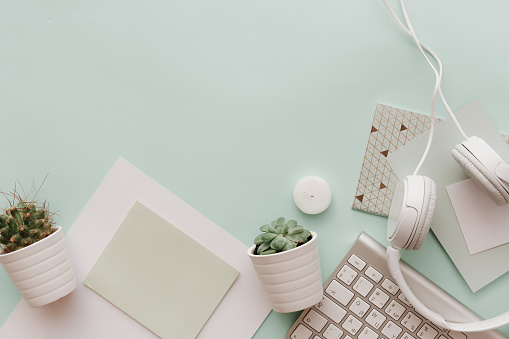 Soft Pastel Styled Desk Scenes With white keyboard, cactus and headphones