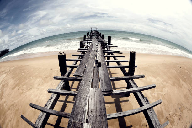 Wooden pier on the seaside landscape in summer time stock photo