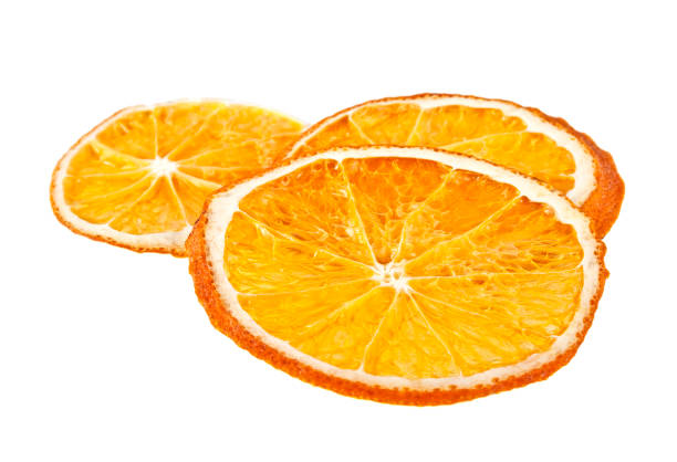 istock Three dried orange slices isolated on white background 916028056