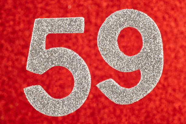 istock Number fifty-nine silver color over a red background. Anniversary. 916029582