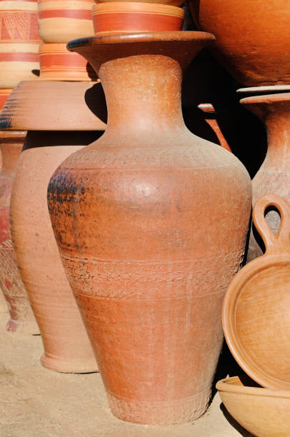 istock Rustic handmade ceramic clay brown terracotta amphora 916039264
