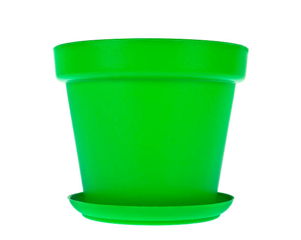 Green plastic flower pots on white background