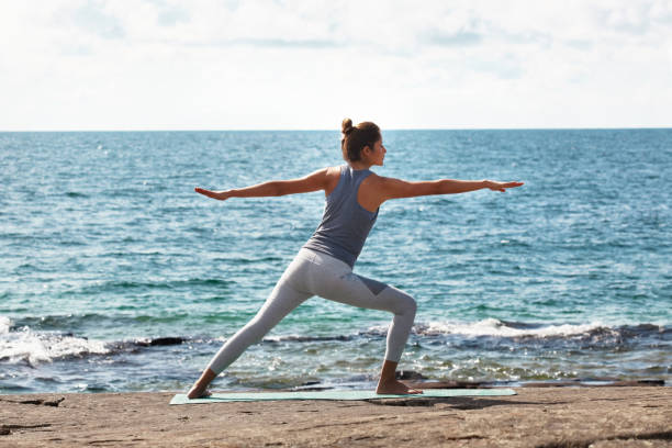 istock Doing yoga by the beach is a great way to distress 916044486
