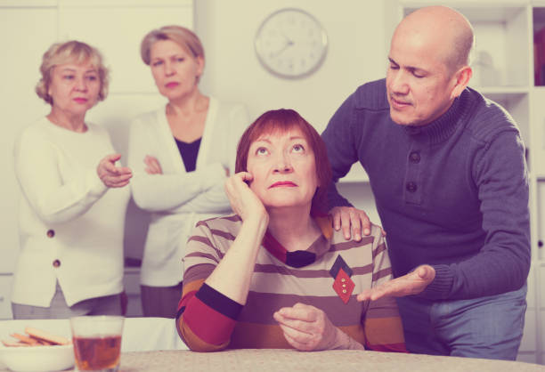 istock Mature man is apologizing to girlfriend for quarrel 916044634