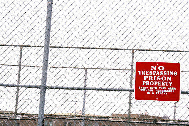 istock Prison Property Sign on Fence: No Trespassing 91604705