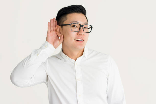 istock Curious employee eavesdropping colleagues talk 916047766
