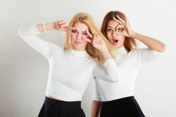 istock Two crazy girls playing around together. 916048290