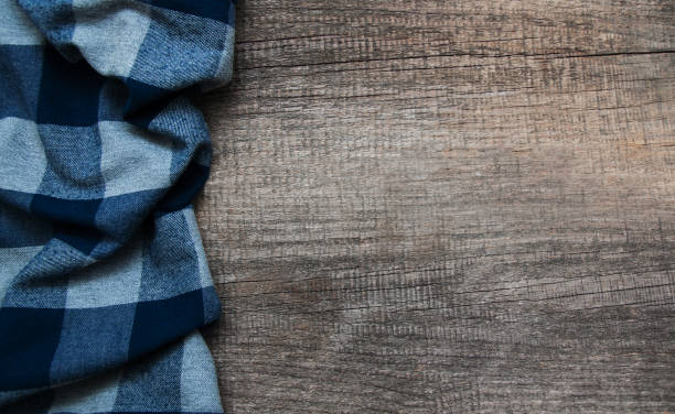 istock Checkered napkin on a wooden background 916048414